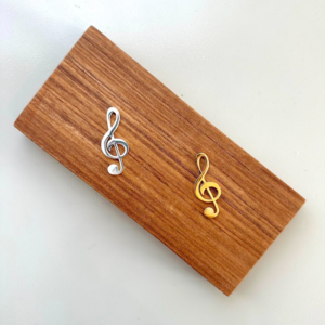 Petite clave de sol de bronce